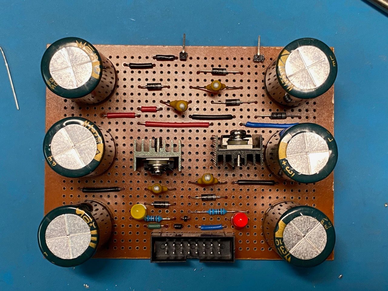 Stripboard with electronic components, box plug, and LEDs
